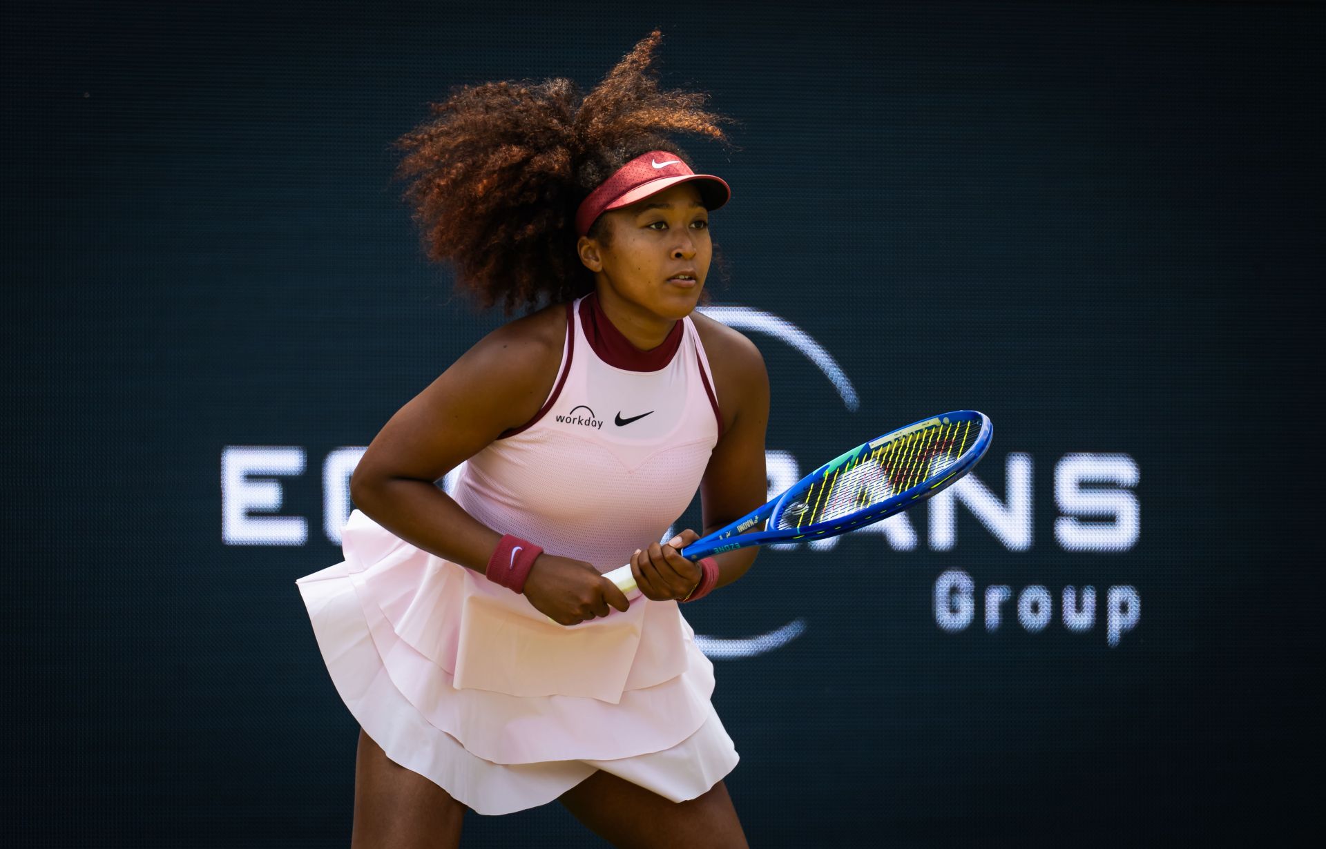 Why do elite players struggle to adapt to grass courts?